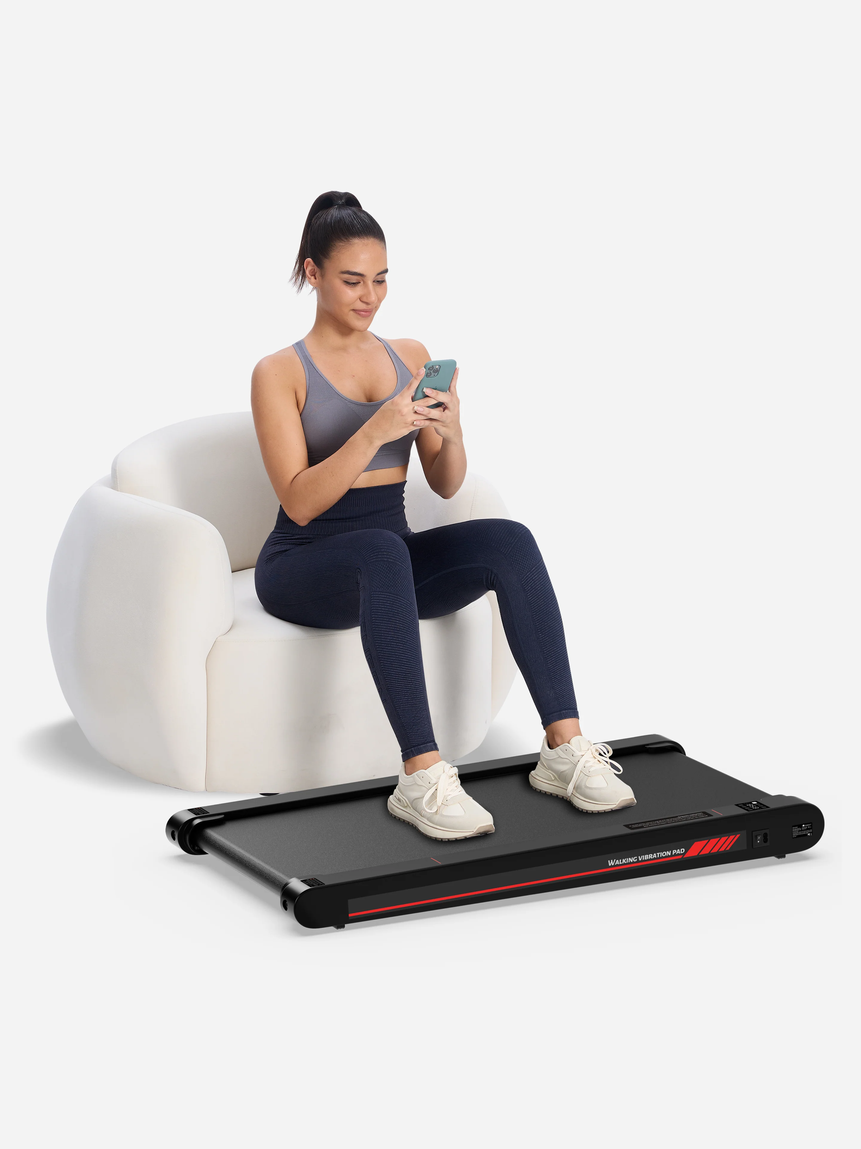 Woman using walking treadmill while working